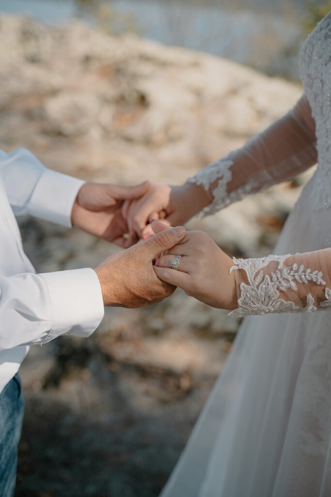 photo of bride and groom holding hands 