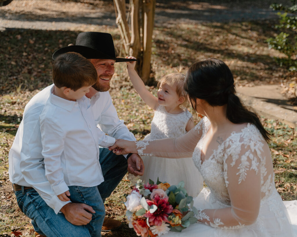 photo of bride and groom and their kids during the first look