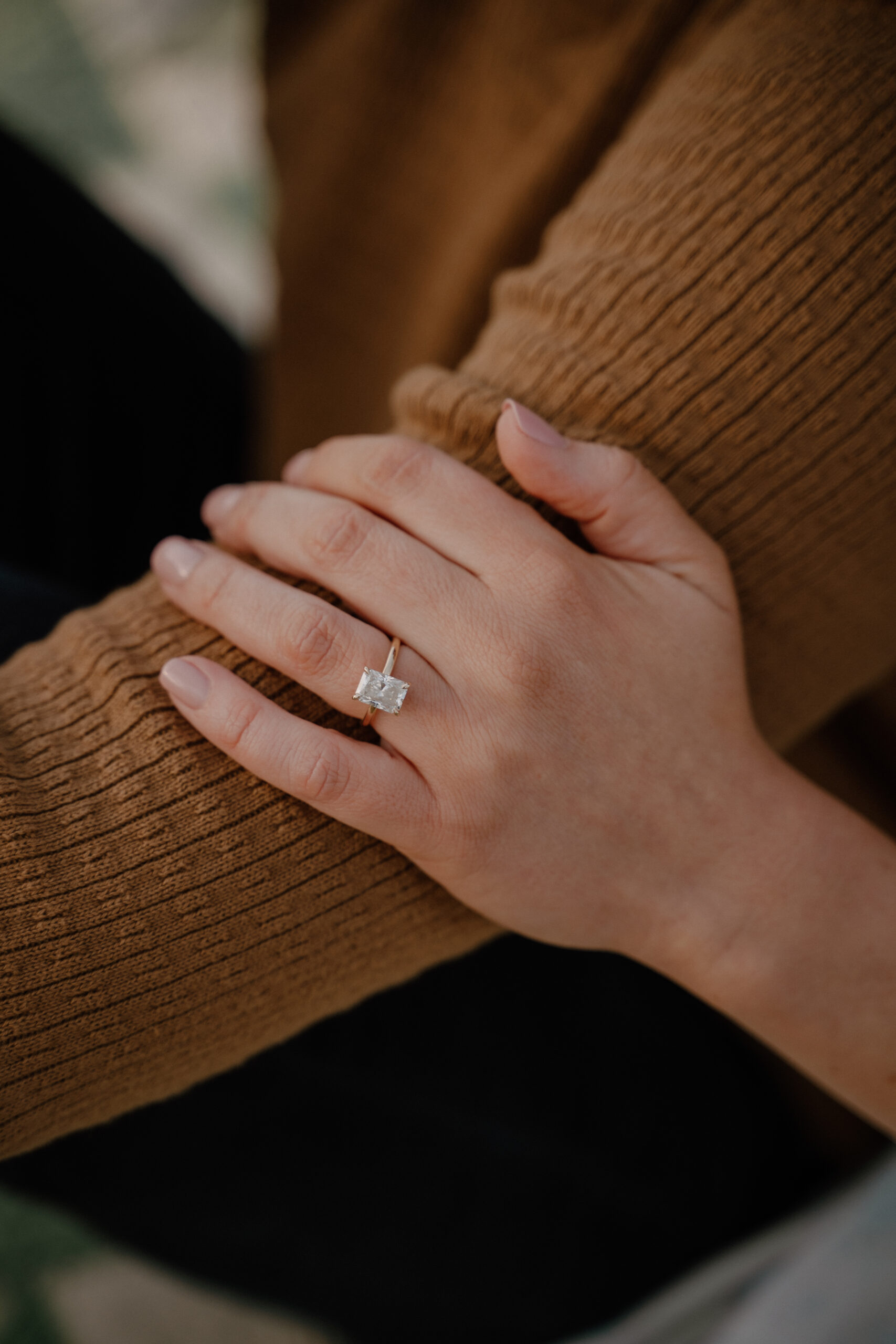 photo of engagement ring on hand