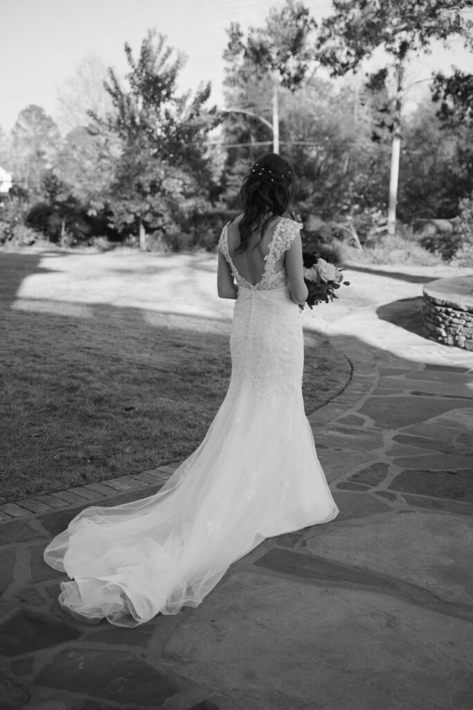 black and white photo showing off a bride's dress