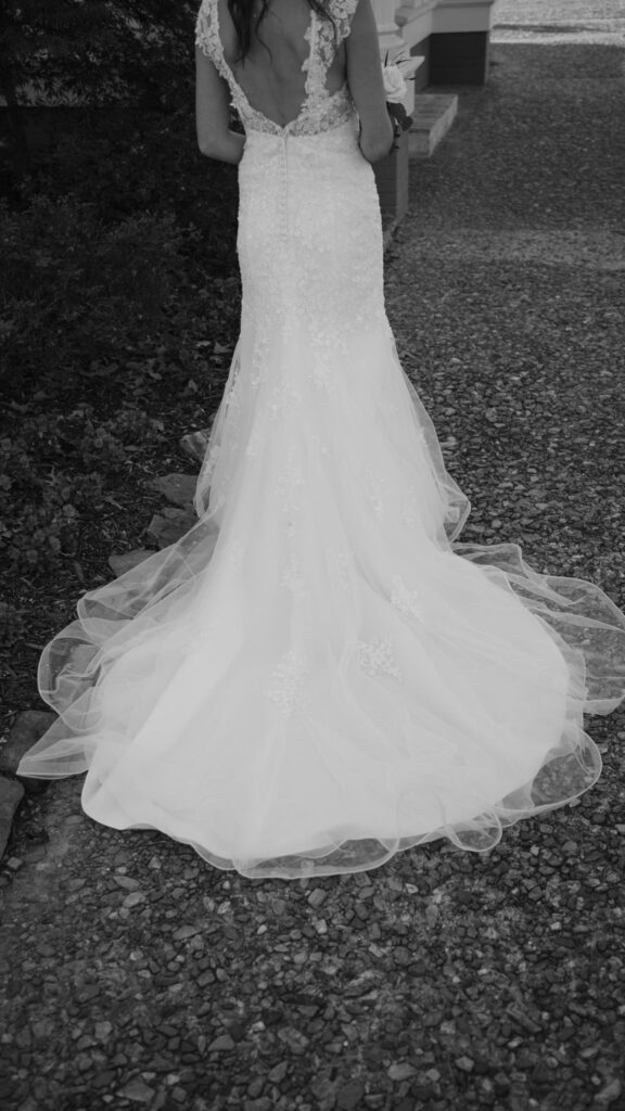 black and white photo of the train of a wedding dress
