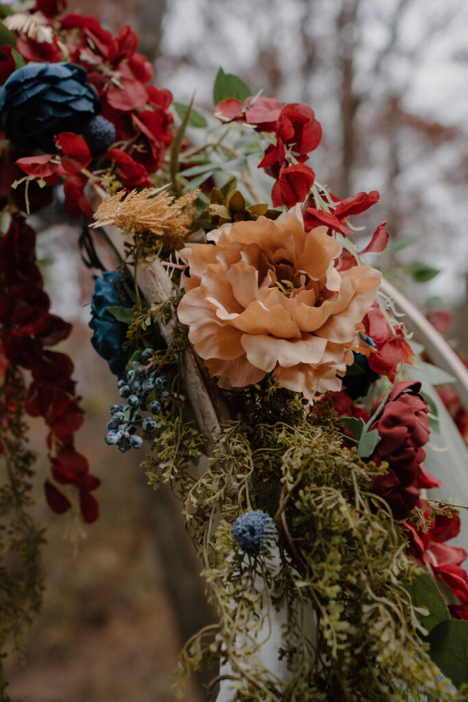 Photo of wedding flowers on a floral arch