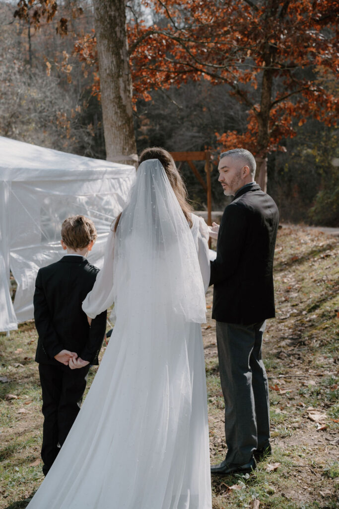 photo of bride talking to the officiant before her wedding