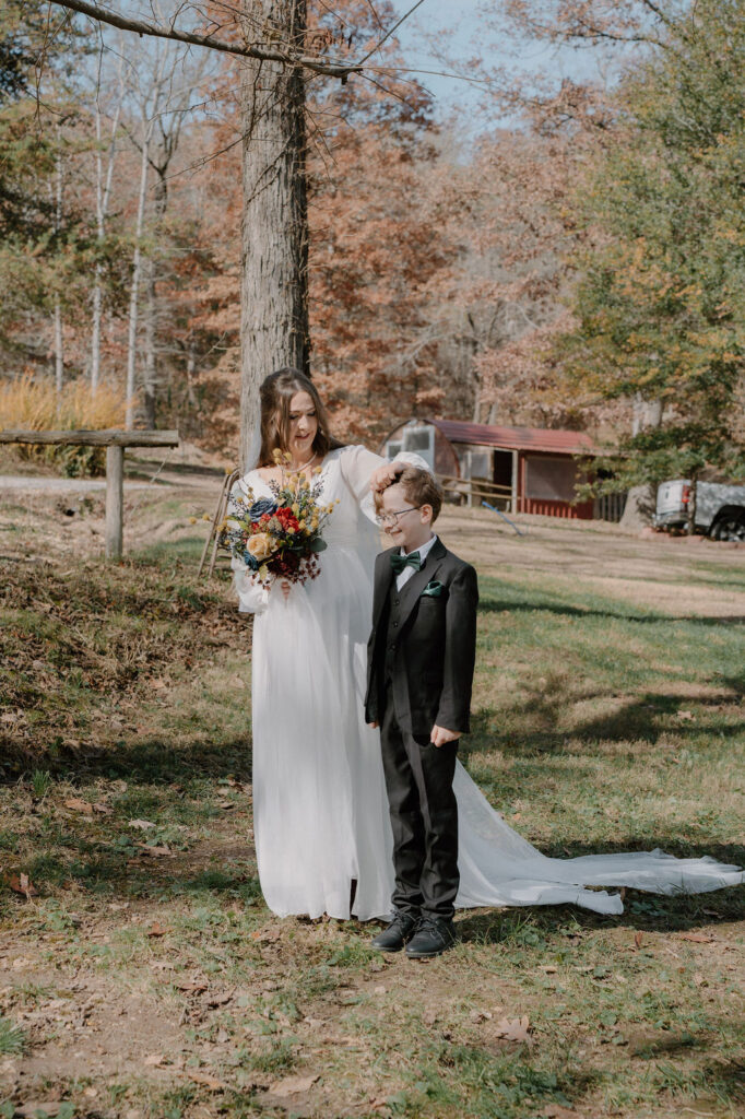 photo of bride and her son before walking down the aisle