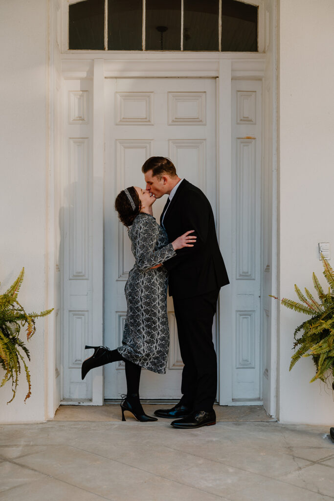 photo of engaged couple kissing