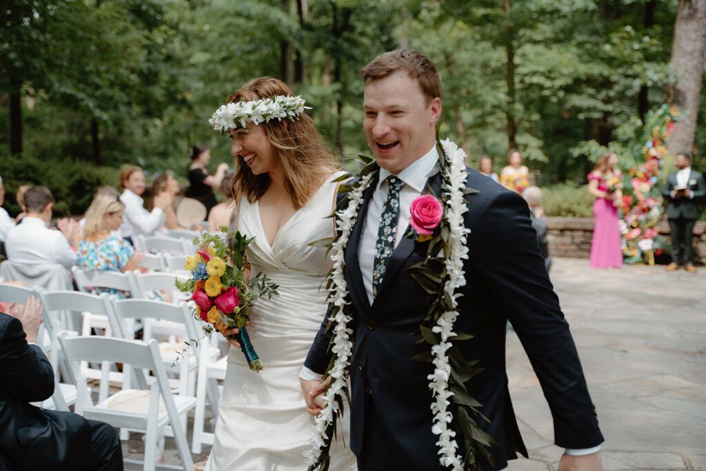 photo of bride and groom exiting the wedding ceremony