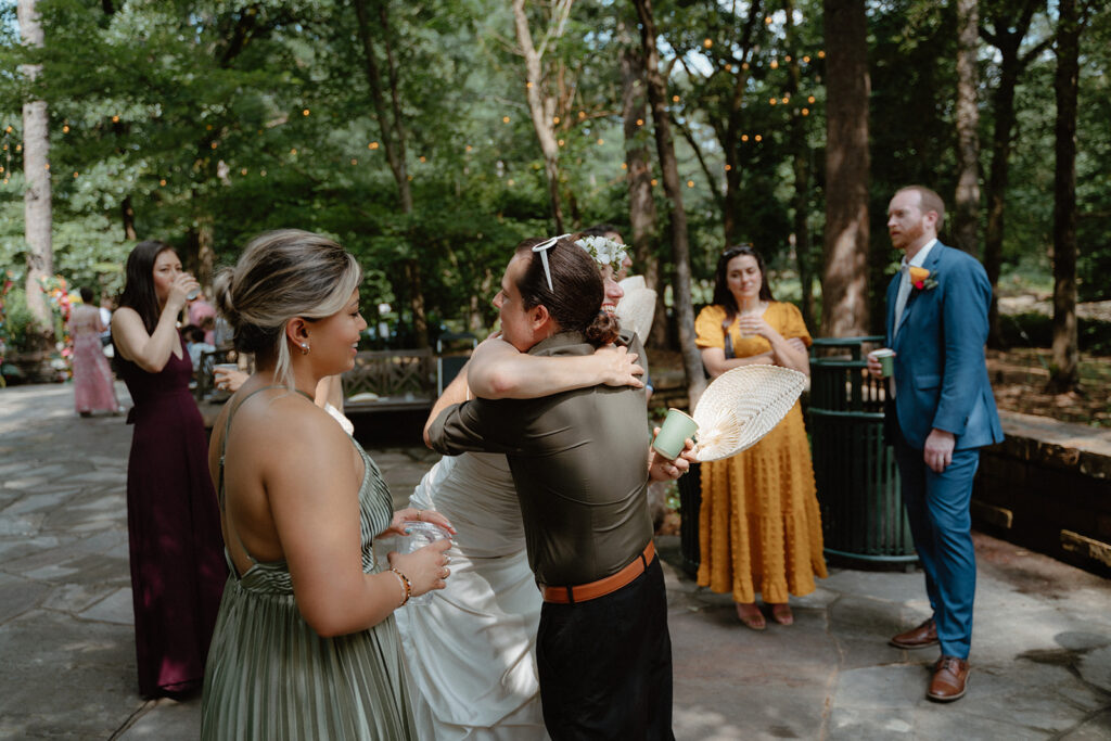 photo of bride hugging friends