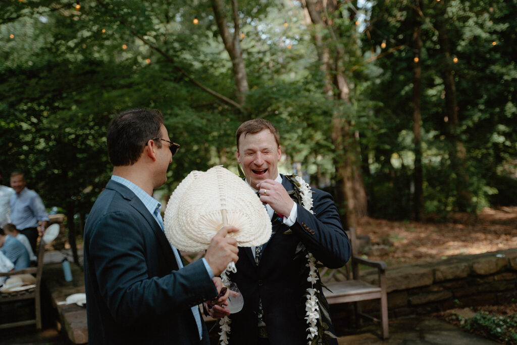 photo of groom and his friend laughing