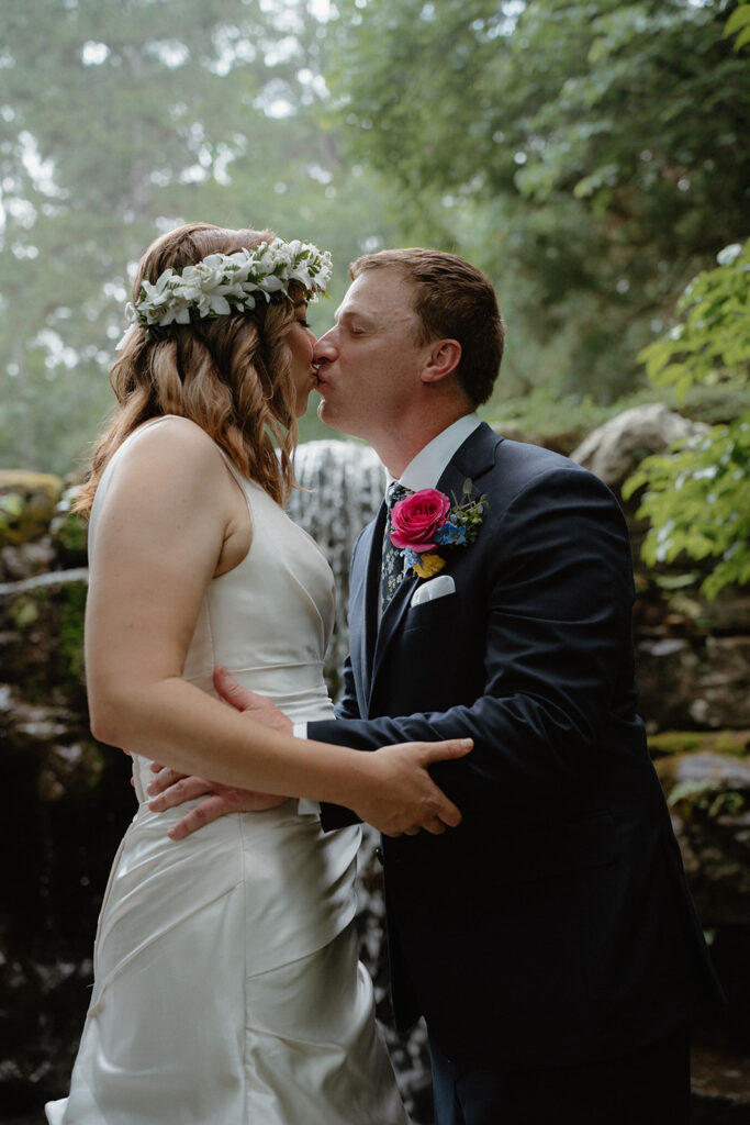 photo of bride and groom kissing at their first look