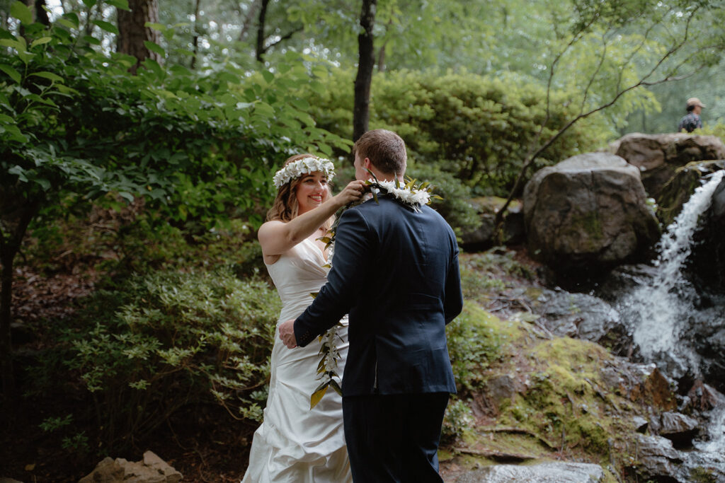 photo of bride giving her groom a lei