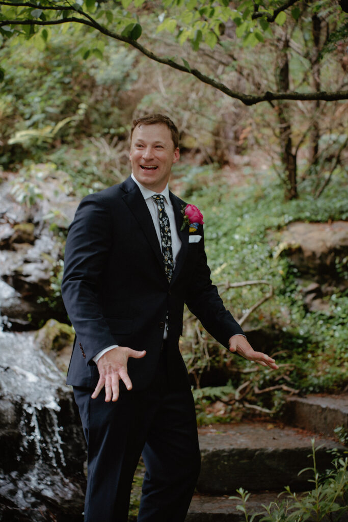 photo of groom turning around during first look