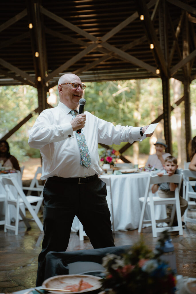 photo of father of the bride doing a dance move