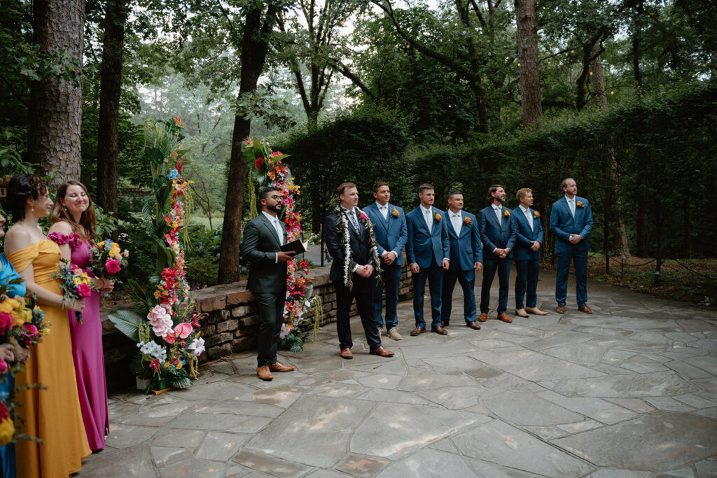 photo of wedding officiant and groom