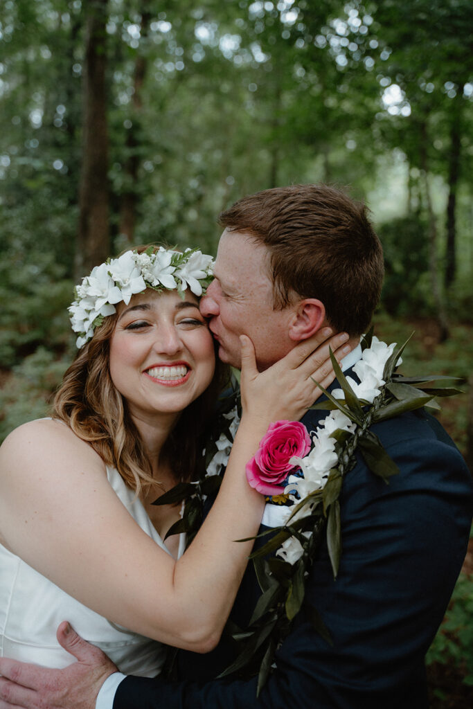 Photo of bride and groom in the forrest in Hot Springs at Garvan Gardens