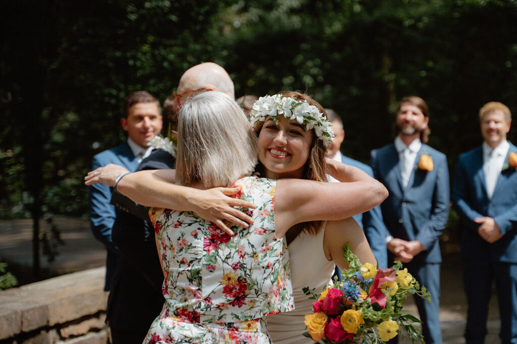 photo of bride hugging her mom