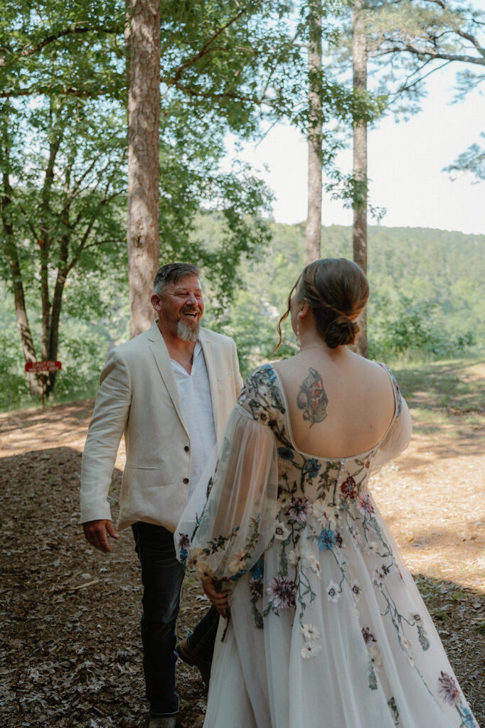 photo of bride and father of the bride's first look