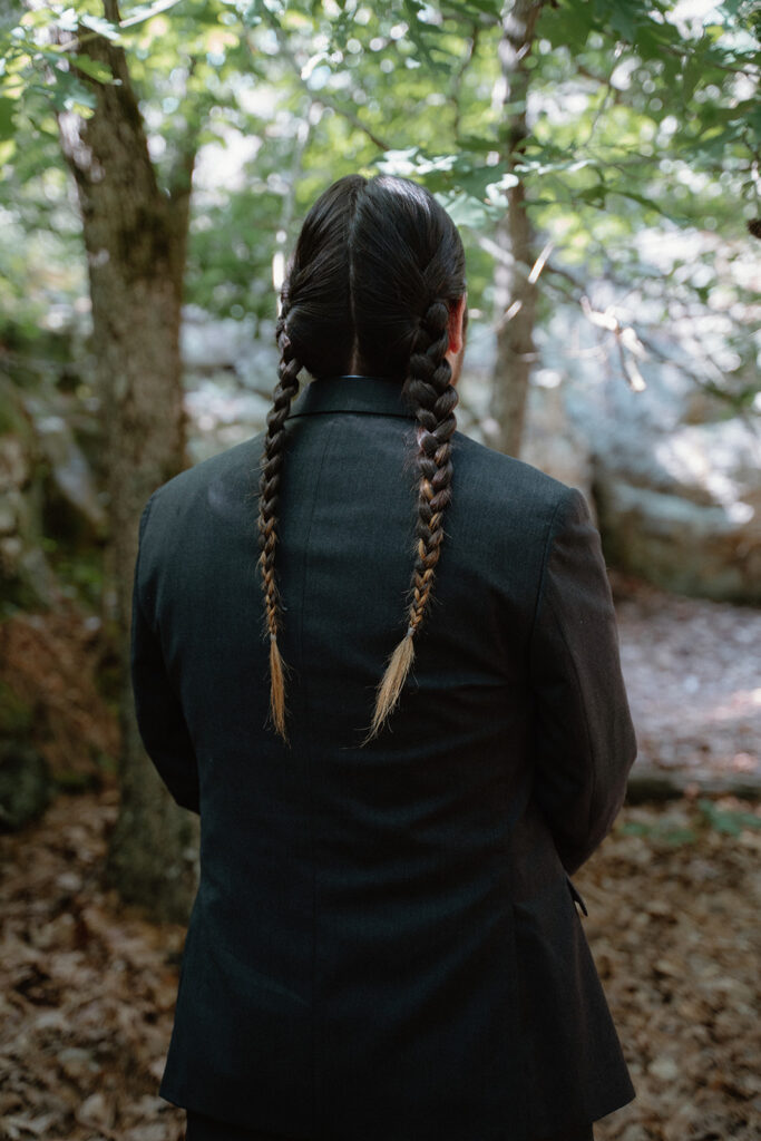 photo of groom at first look