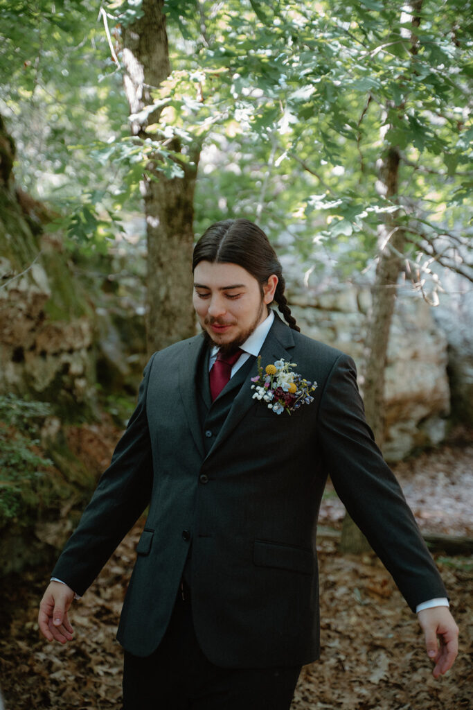 photo of groom at first look