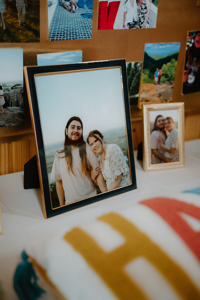 photo of engagement photo on table at wedding reception