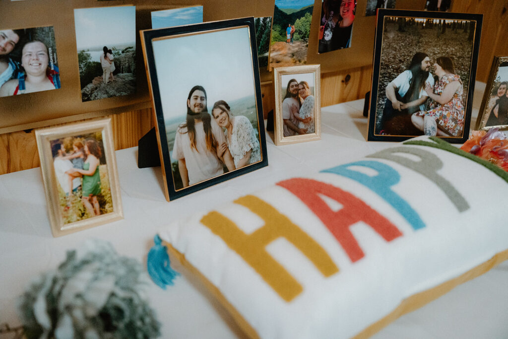 photo of engagement photo on table at wedding reception