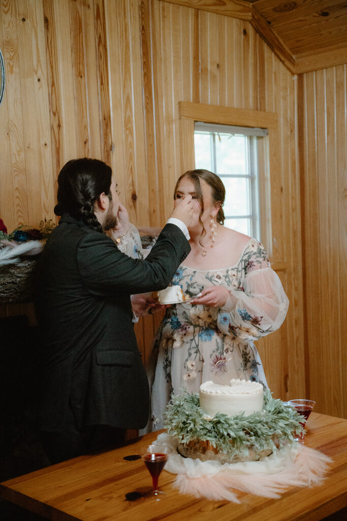 photo of cake cutting at wedding reception