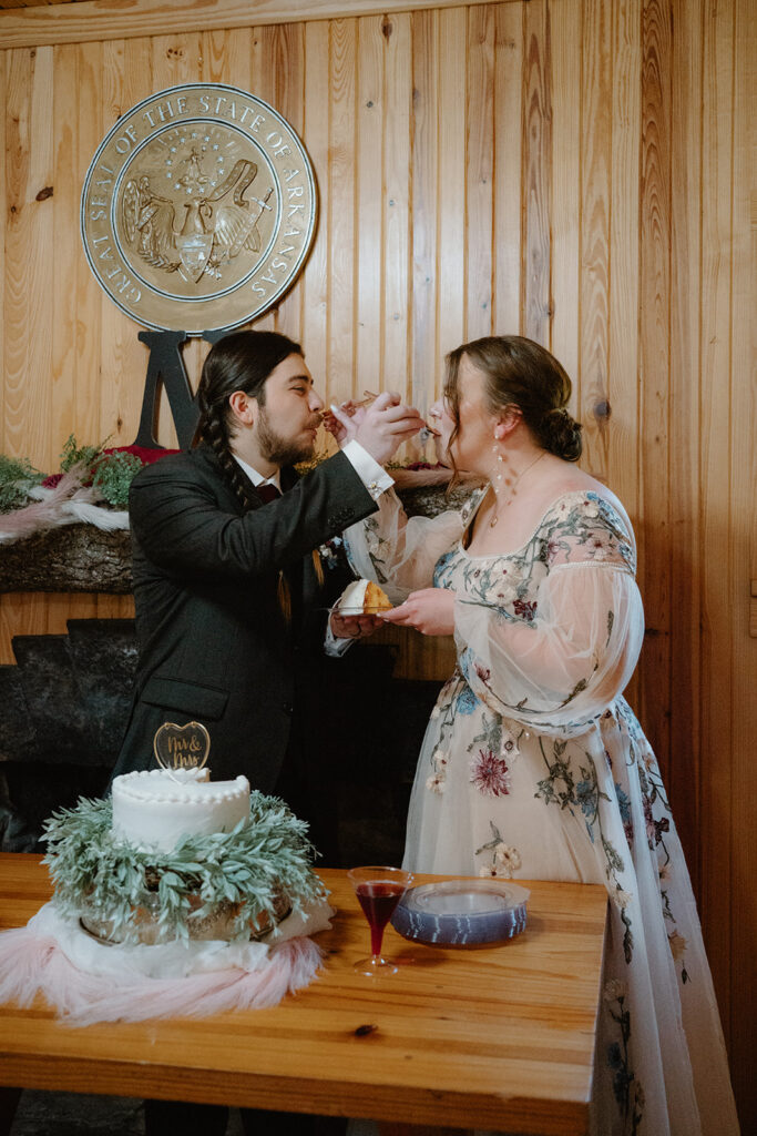 photo of cake cutting at wedding reception