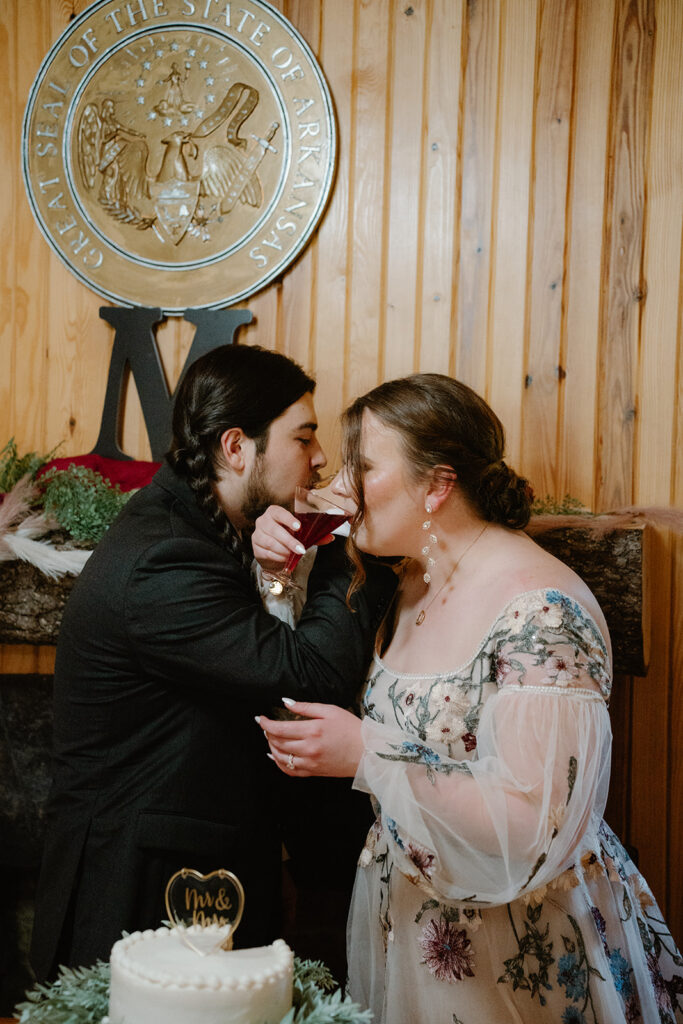 photo of cake cutting at wedding reception