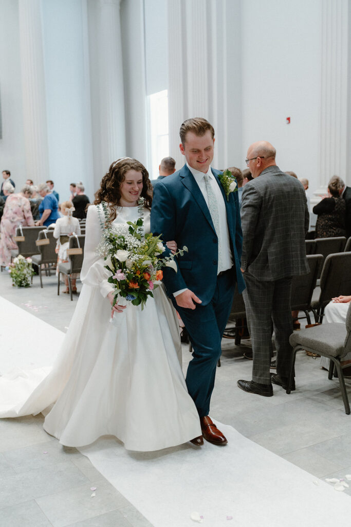 photo of bride and groom exiting the wedding ceremony