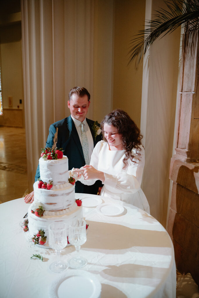 photo of bride and groom eating cake