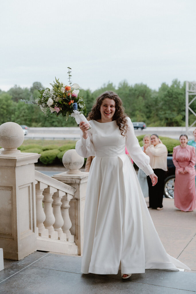 photo of bride getting ready to throw her bouquet