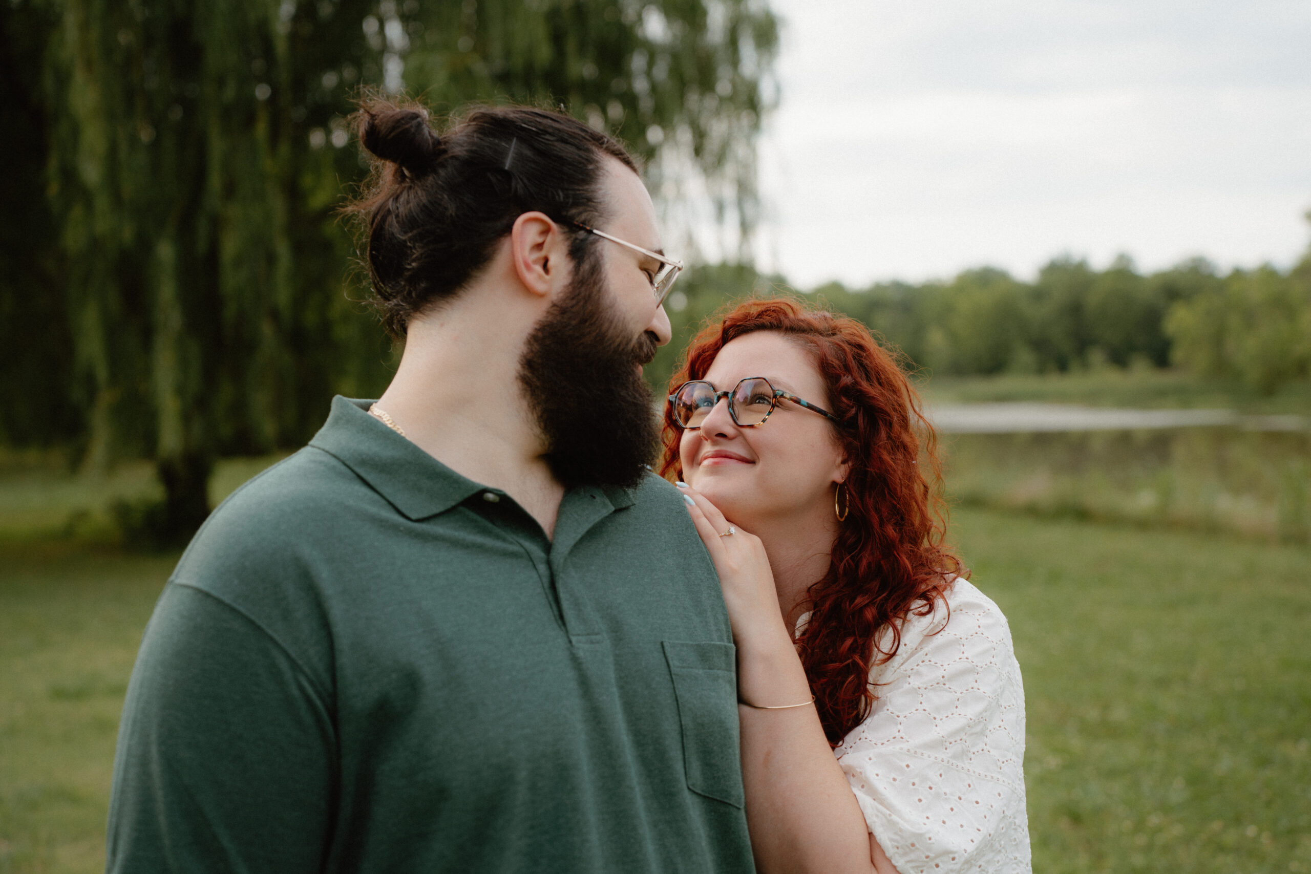 photo of a couple looking at each other in a park