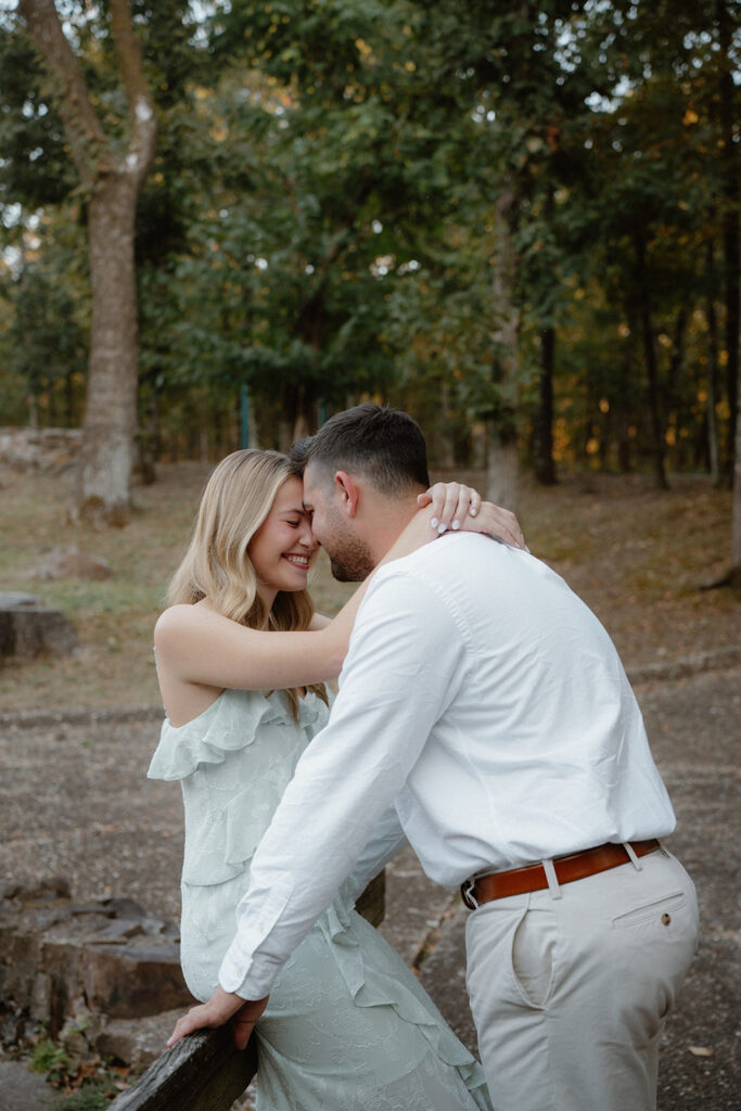 engaged couple posing for photo