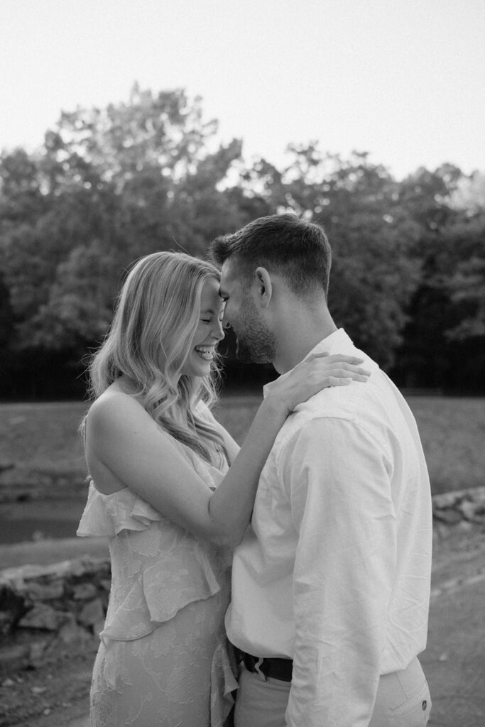 photo of engaged couple hugging after proposing