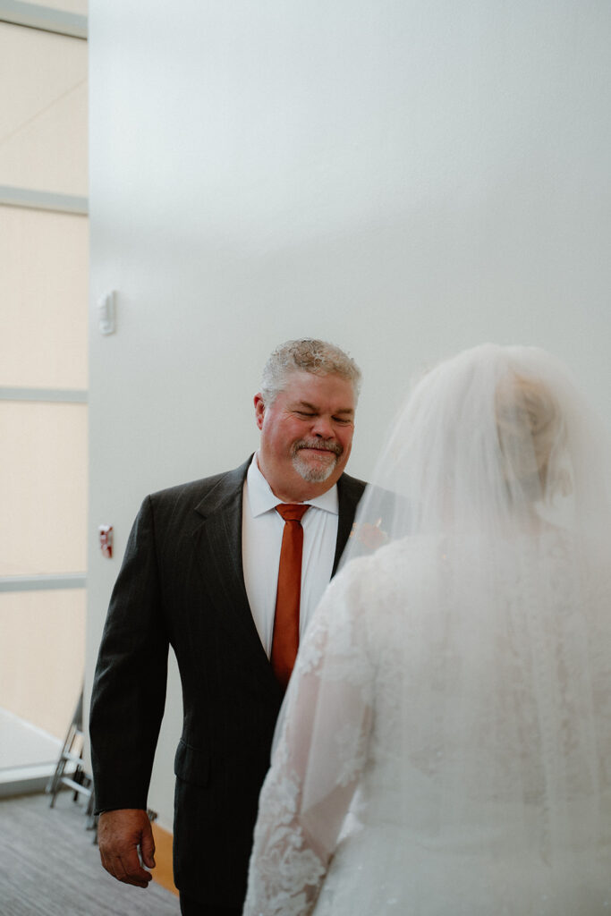 Bride and father of the bride first look