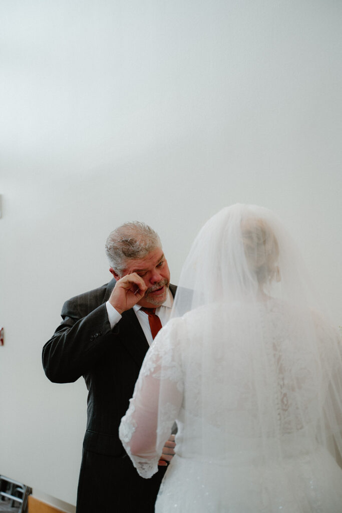 Bride and father of the bride first look